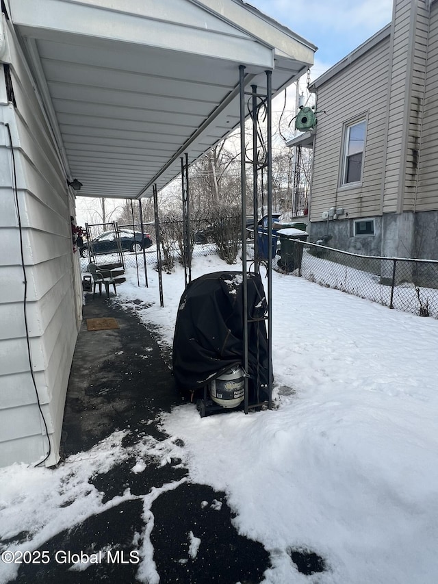 view of yard layered in snow