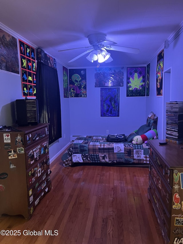 bedroom with hardwood / wood-style flooring and ceiling fan