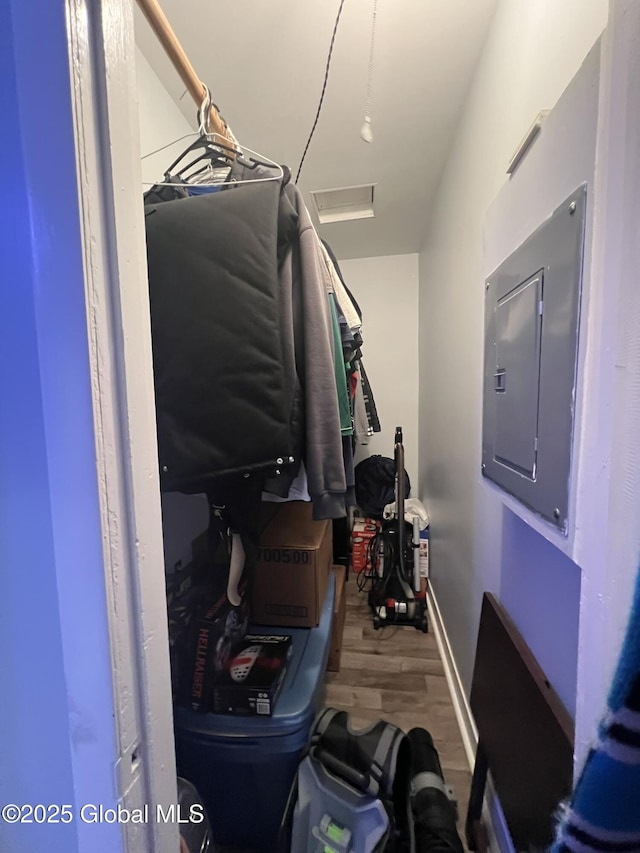 spacious closet featuring wood-type flooring and electric panel