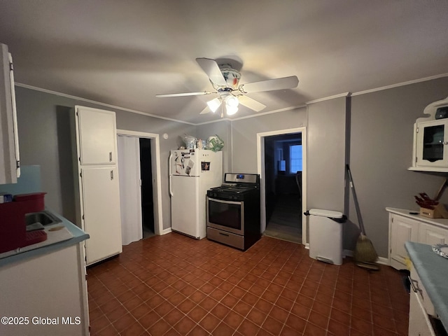 kitchen featuring white cabinetry, crown molding, white refrigerator, stainless steel range, and ceiling fan