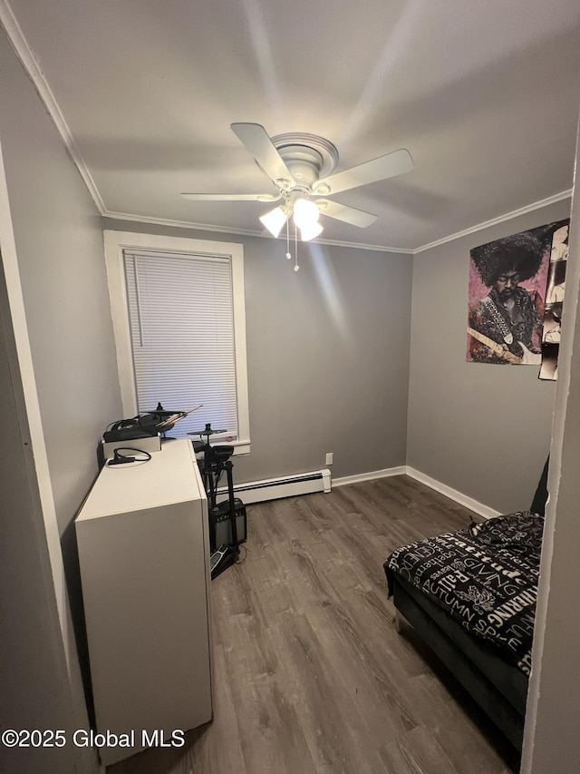 interior space featuring hardwood / wood-style floors, ornamental molding, and ceiling fan