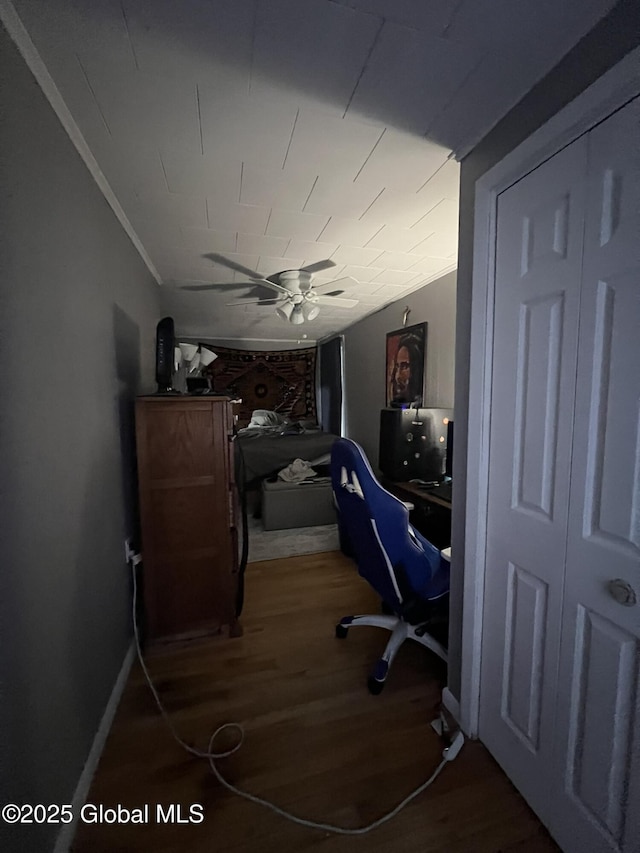 home office featuring hardwood / wood-style floors and ceiling fan