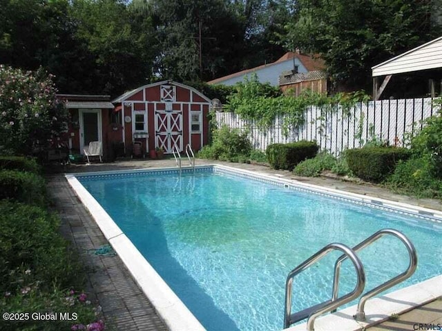 view of swimming pool with a shed