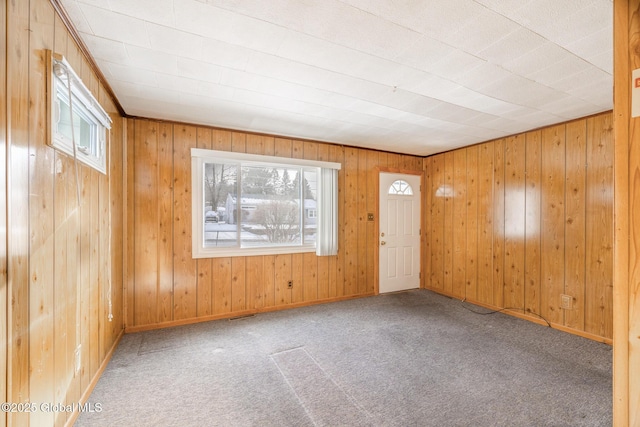 unfurnished room with carpet flooring