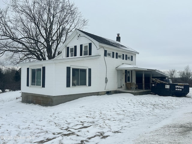 view of snow covered house