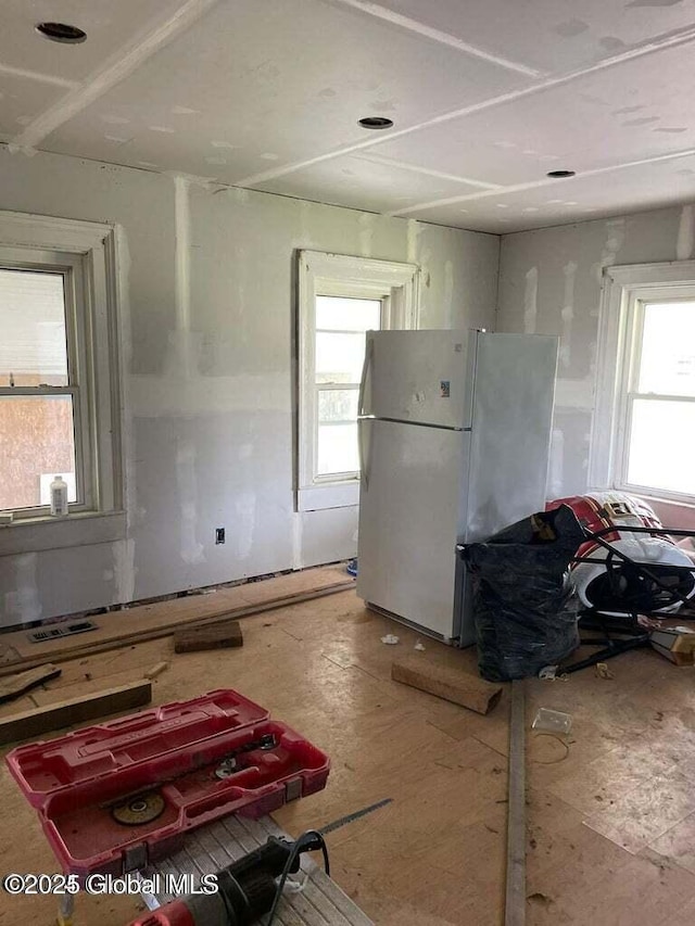 kitchen with plenty of natural light and white refrigerator