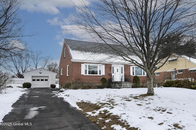 view of front facade featuring a garage and an outdoor structure