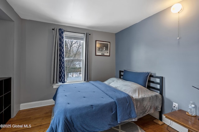 bedroom featuring wood-type flooring