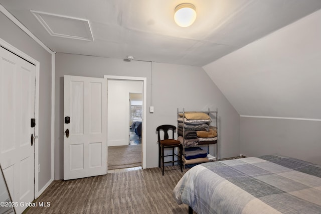 carpeted bedroom featuring a closet and lofted ceiling