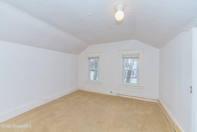 bonus room with carpet and vaulted ceiling