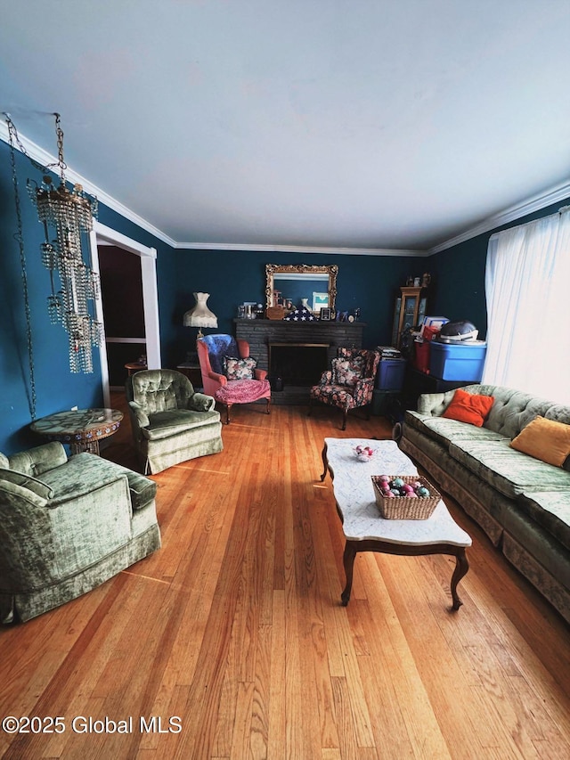 living room featuring wood-type flooring and crown molding