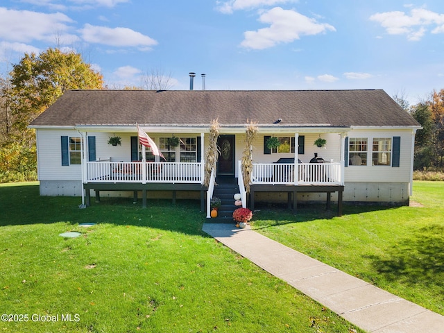 view of front facade featuring a front lawn and covered porch