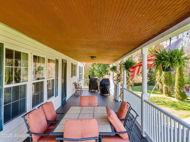 wooden deck with grilling area