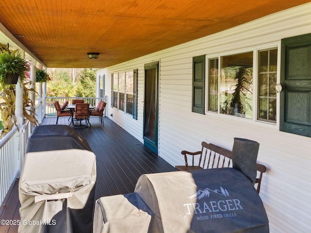 wooden terrace featuring a porch