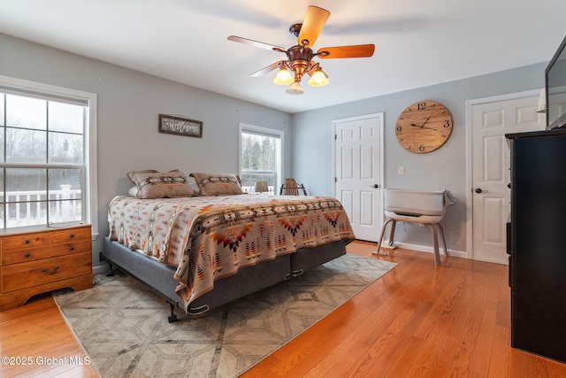 bedroom featuring ceiling fan and light hardwood / wood-style floors