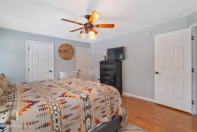 bedroom featuring ceiling fan and light hardwood / wood-style floors