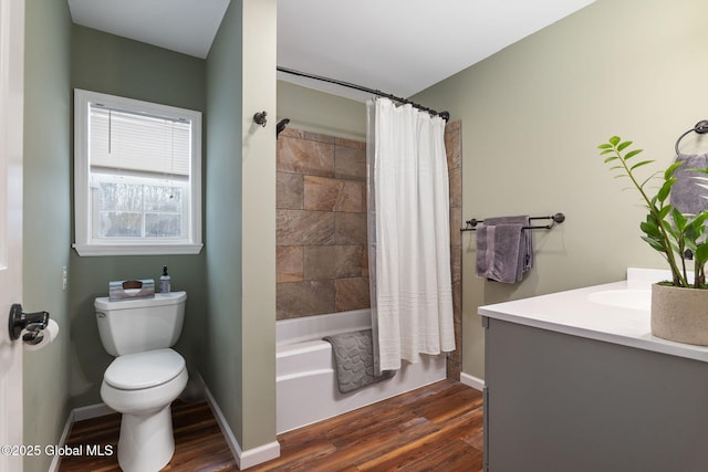 full bathroom with toilet, shower / bath combo, hardwood / wood-style flooring, and vanity