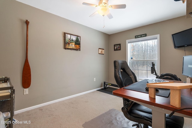 carpeted home office with ceiling fan