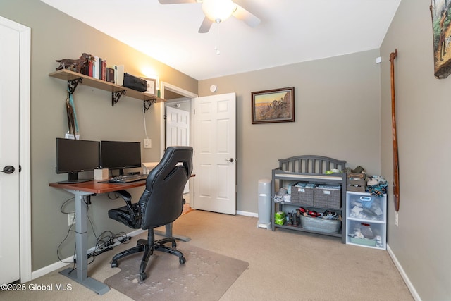 carpeted office with ceiling fan