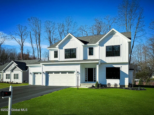 view of front facade featuring a garage and a front lawn