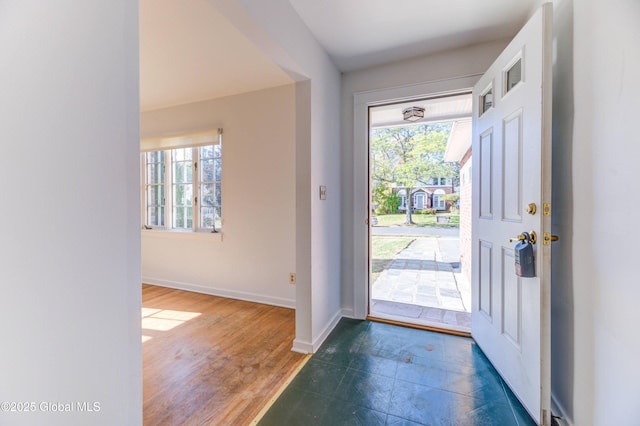 foyer entrance featuring dark hardwood / wood-style floors