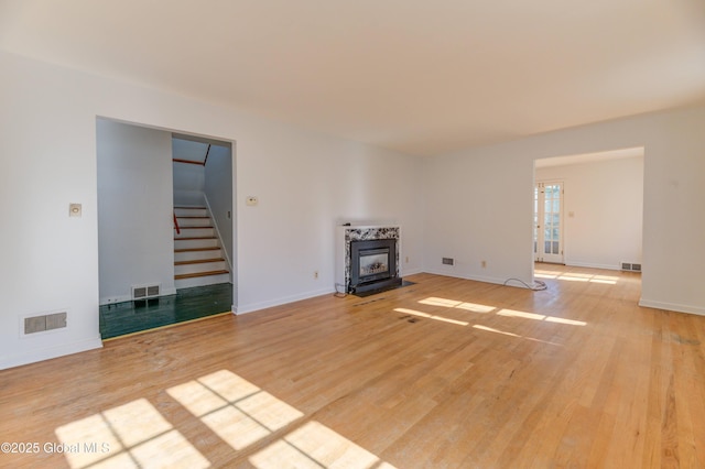 unfurnished living room featuring light wood-type flooring