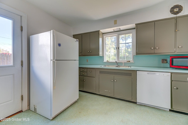 kitchen with gray cabinets, white appliances, and sink