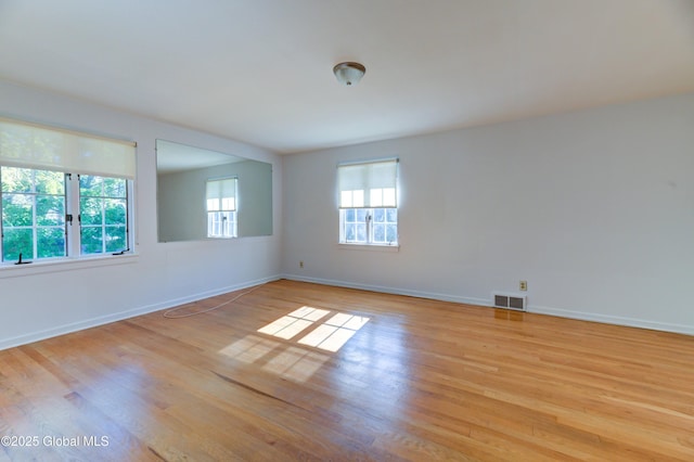 spare room with light wood-type flooring