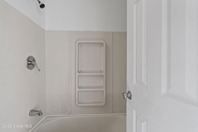 bathroom with shower / washtub combination