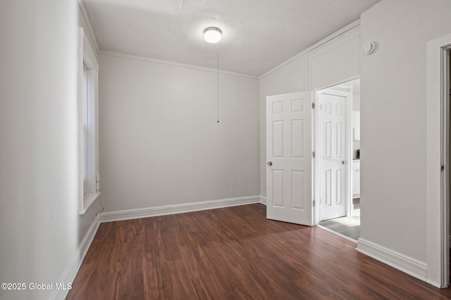 unfurnished room featuring dark hardwood / wood-style flooring, a textured ceiling, and crown molding