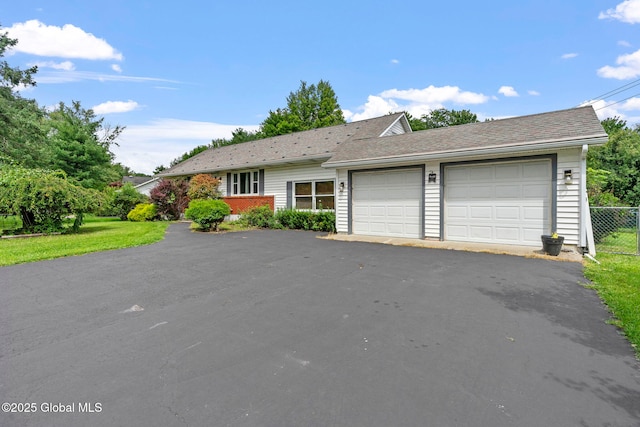 single story home featuring a garage