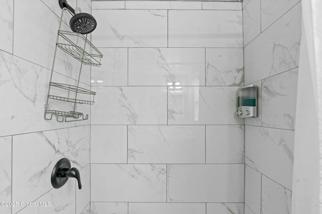 interior details with a tile shower