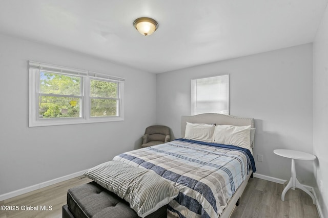 bedroom with light hardwood / wood-style floors