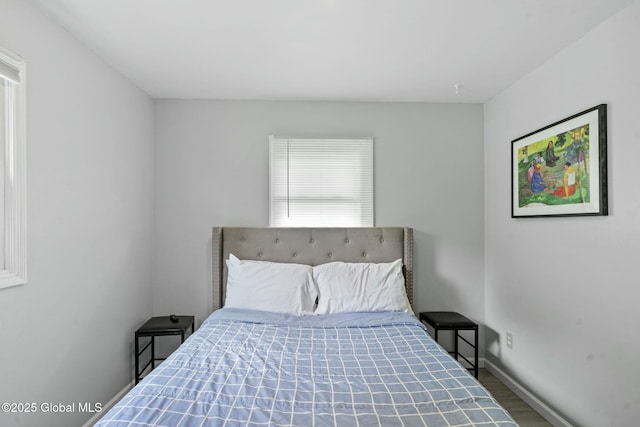 bedroom with hardwood / wood-style flooring