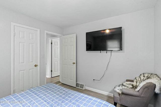 bedroom featuring hardwood / wood-style flooring