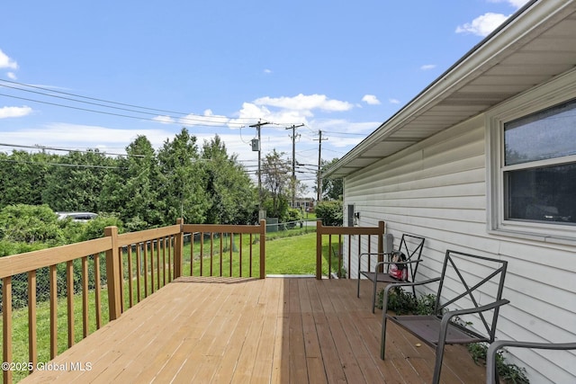 wooden deck with a yard