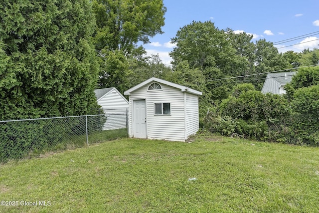 view of outbuilding featuring a lawn