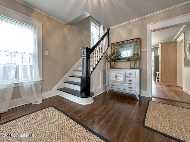 staircase featuring hardwood / wood-style floors and crown molding