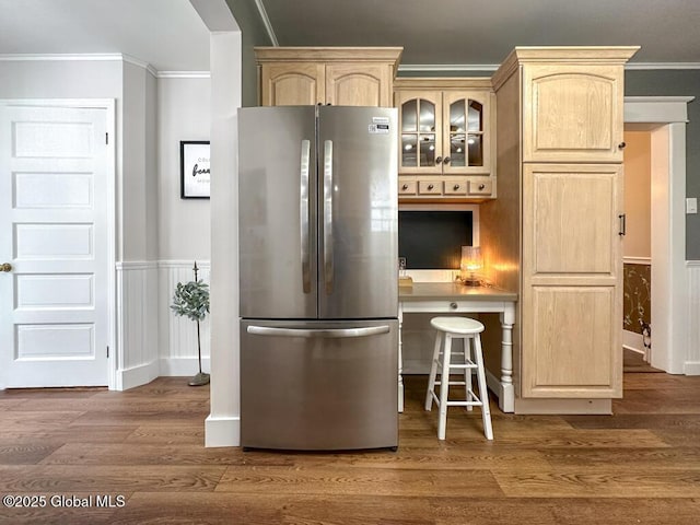 kitchen featuring stainless steel refrigerator, ornamental molding, dark hardwood / wood-style floors, and light brown cabinets