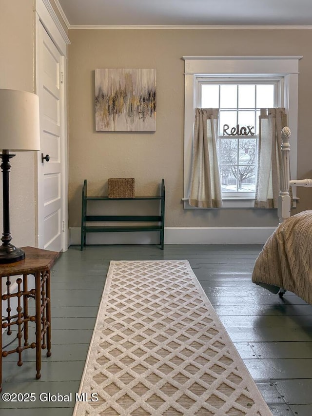 bedroom featuring dark wood-type flooring and crown molding