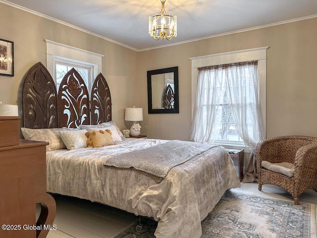 bedroom featuring ornamental molding and a chandelier