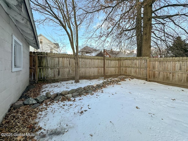 view of yard covered in snow