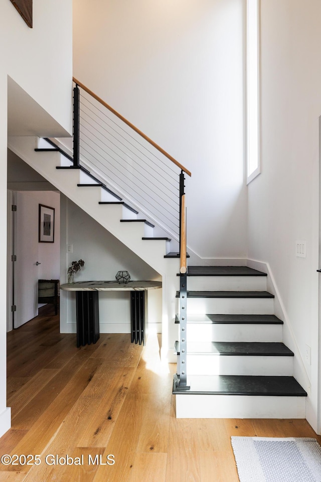 stairs with wood-type flooring