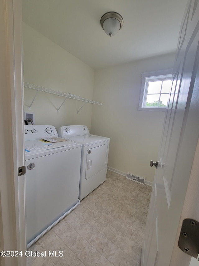 laundry room featuring washing machine and dryer