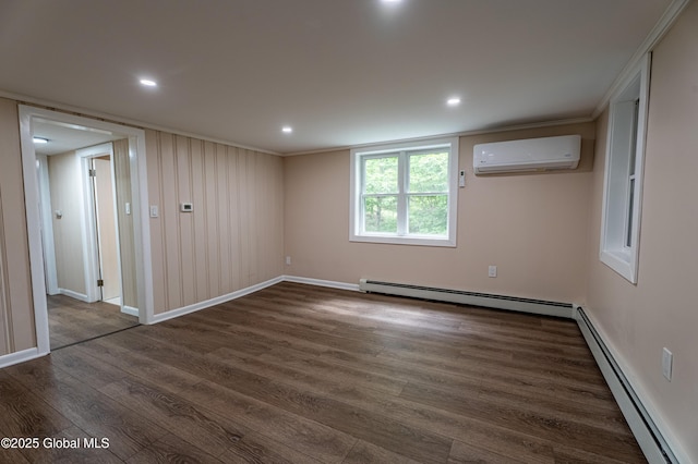 13 Camel Hill Rd, Brunswick, NY 12180 - spare room with a wall unit AC, a baseboard radiator, dark wood-style flooring, baseboards, and recessed lighting
