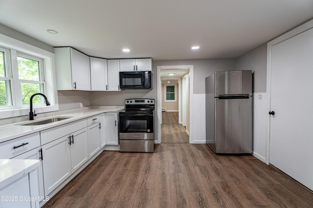 13 Camel Hill Rd, Brunswick, NY 12180 - kitchen with appliances with stainless steel finishes, a sink, dark wood-type flooring, white cabinetry, and recessed lighting