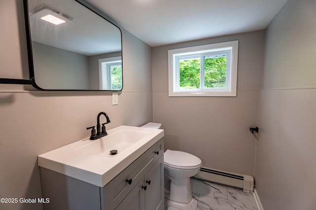 13 Camel Hill Rd, Brunswick, NY 12180 - bathroom with baseboard heating, vanity, marble look tile flooring, and toilet