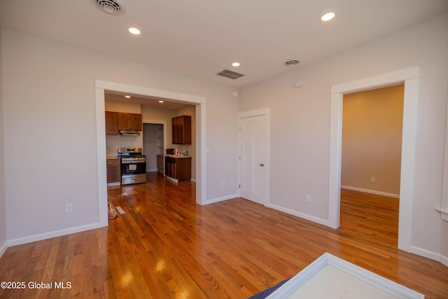 empty room featuring wood-type flooring