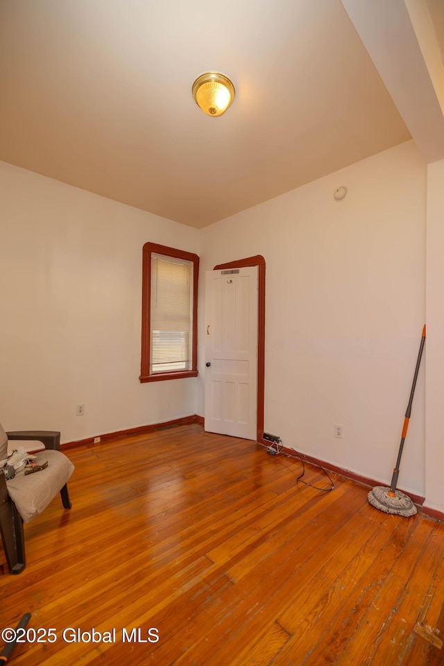 spare room with light hardwood / wood-style flooring