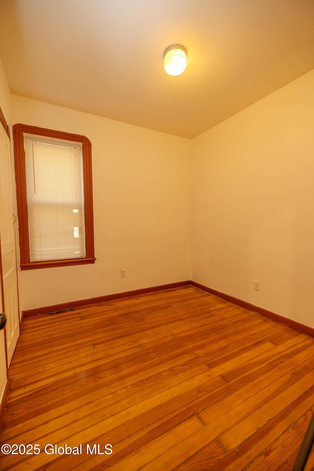 empty room with light wood-type flooring